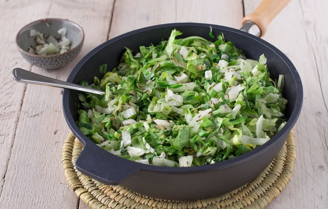 Endive stir-fried with caraway
