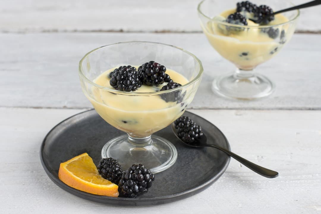Blackberry dessert with ladyfingers and vanilla custard