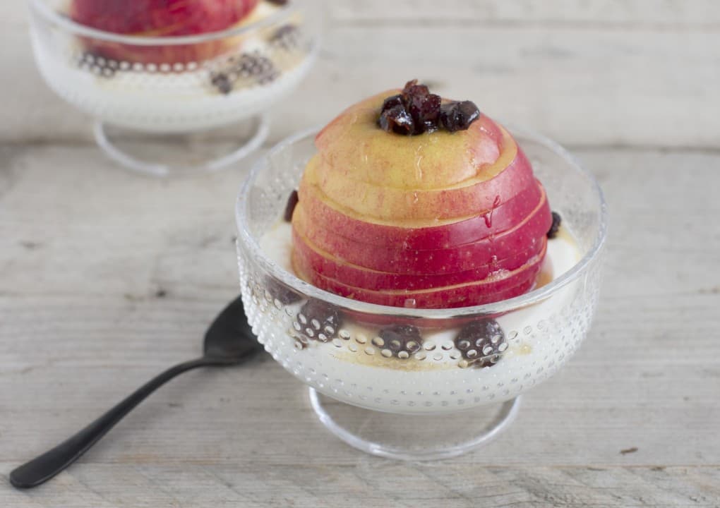 Tasty quick dessert with apple, honey and cranberries