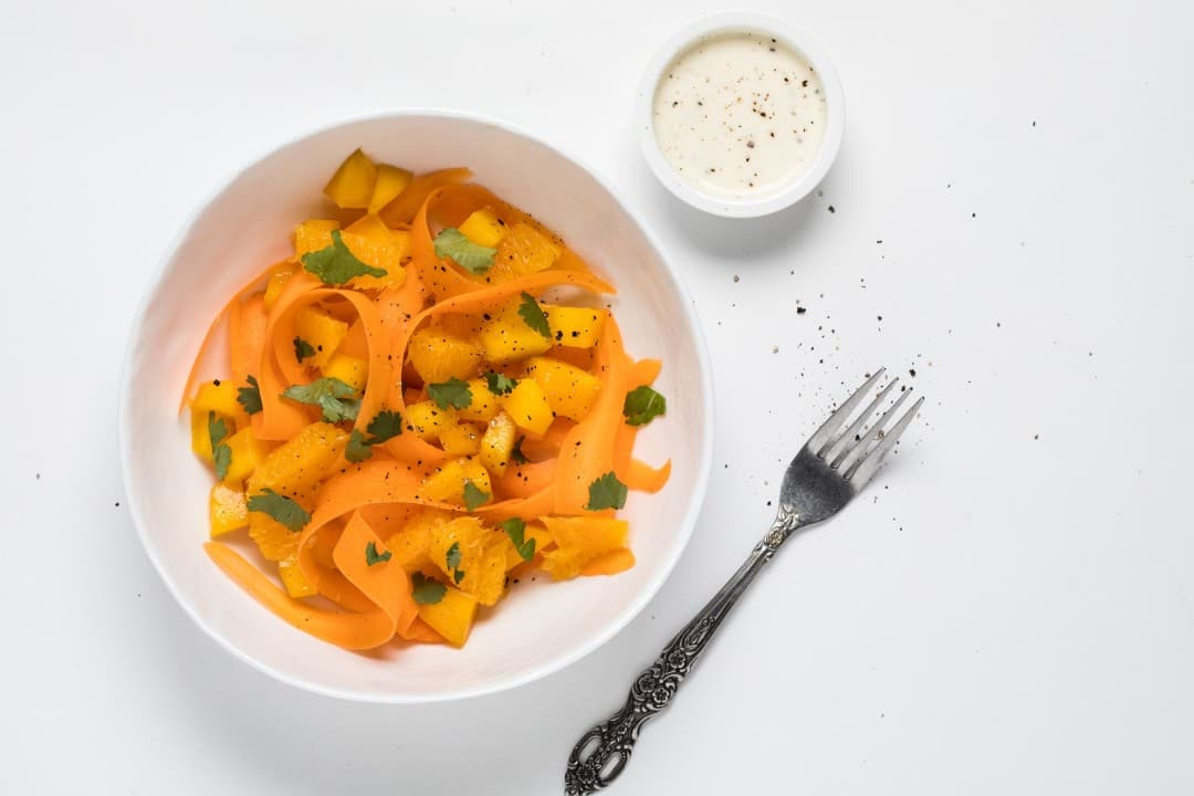 Carrot salad with mango and orange