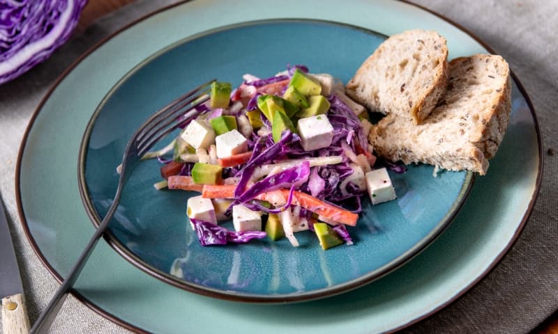 Purple pointed cabbage salad with avocado, pear and goat cheese