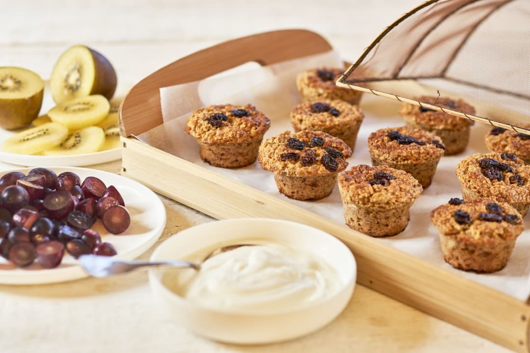 Sweet breakfast muffins with banana, kiwi and grapes
