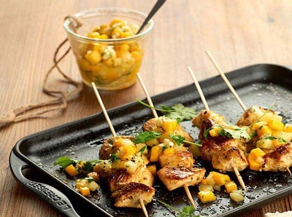 Chicken skewer with yellow kiwi and mango sauce