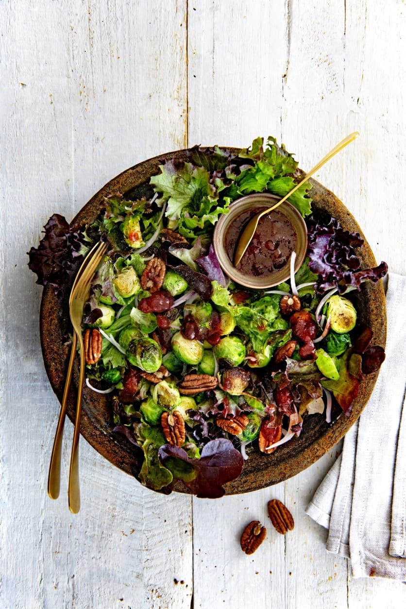 Meal salad with roasted Brussels sprouts, pecans and cranberry dressing